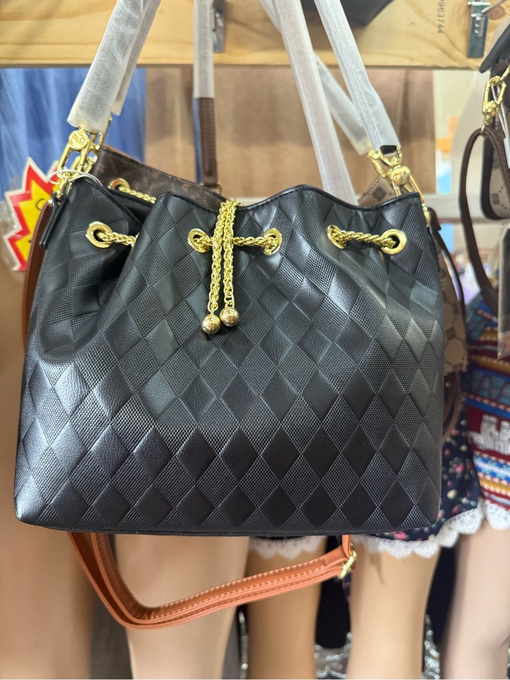 Women's Black Quilted Drawstring Bucket Bag with Gold Chain Accents